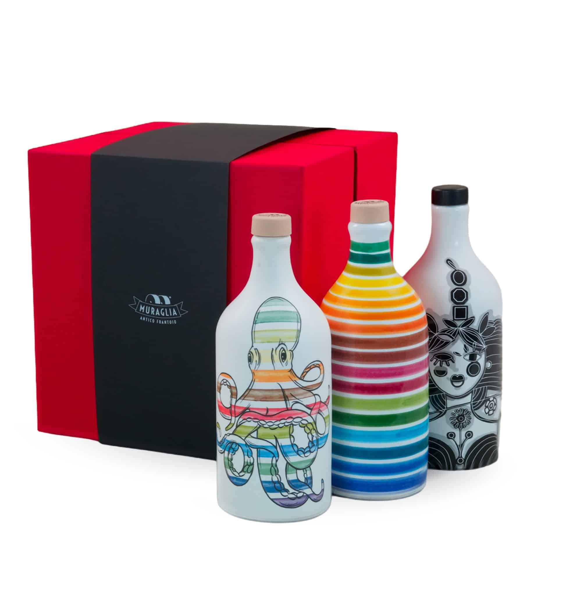 Cofanetto regalo rosso con tre bottiglie di olio extravergine dai decori artistici diversi